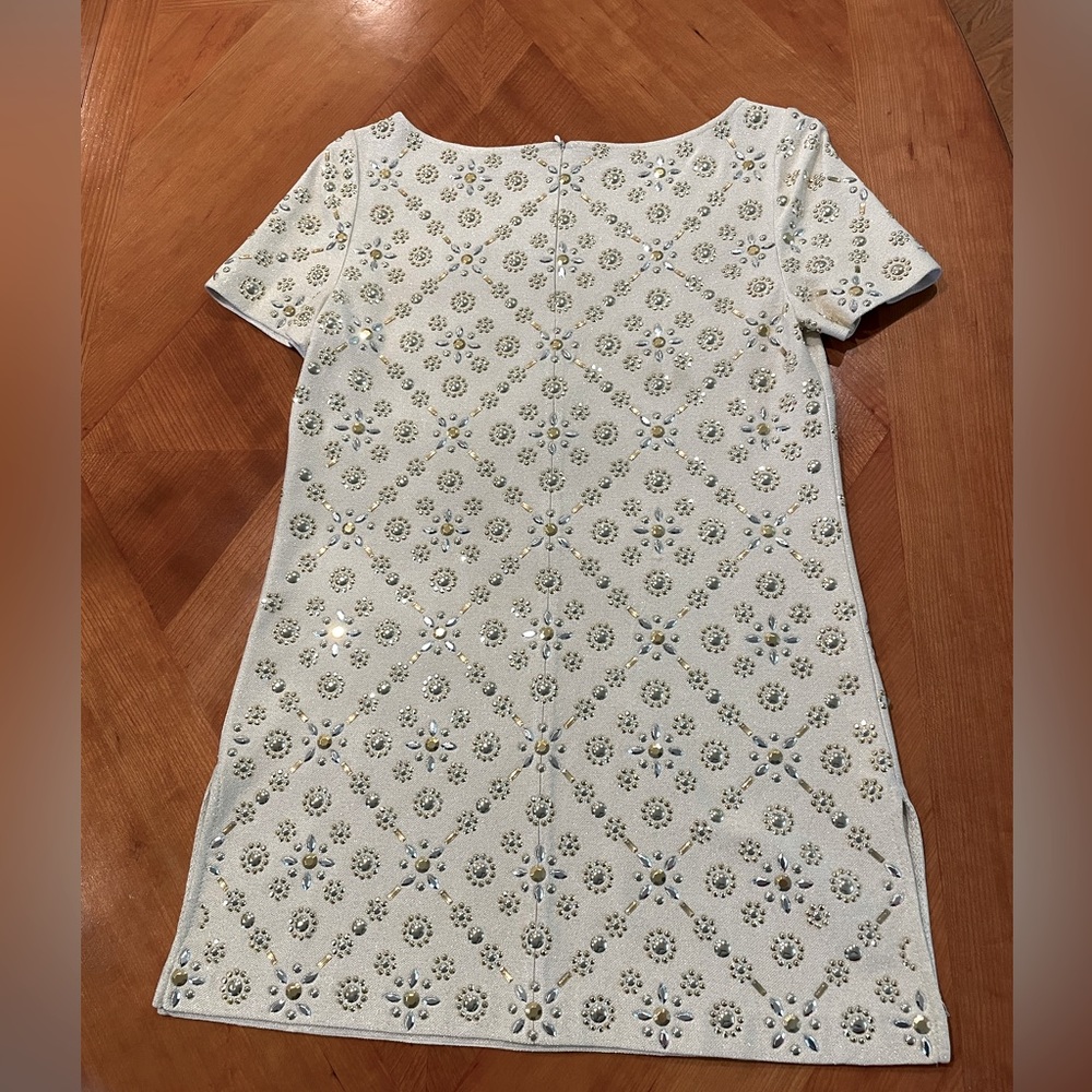 St.John Couture tunic. Never been worn. Silver and gold embellishment.